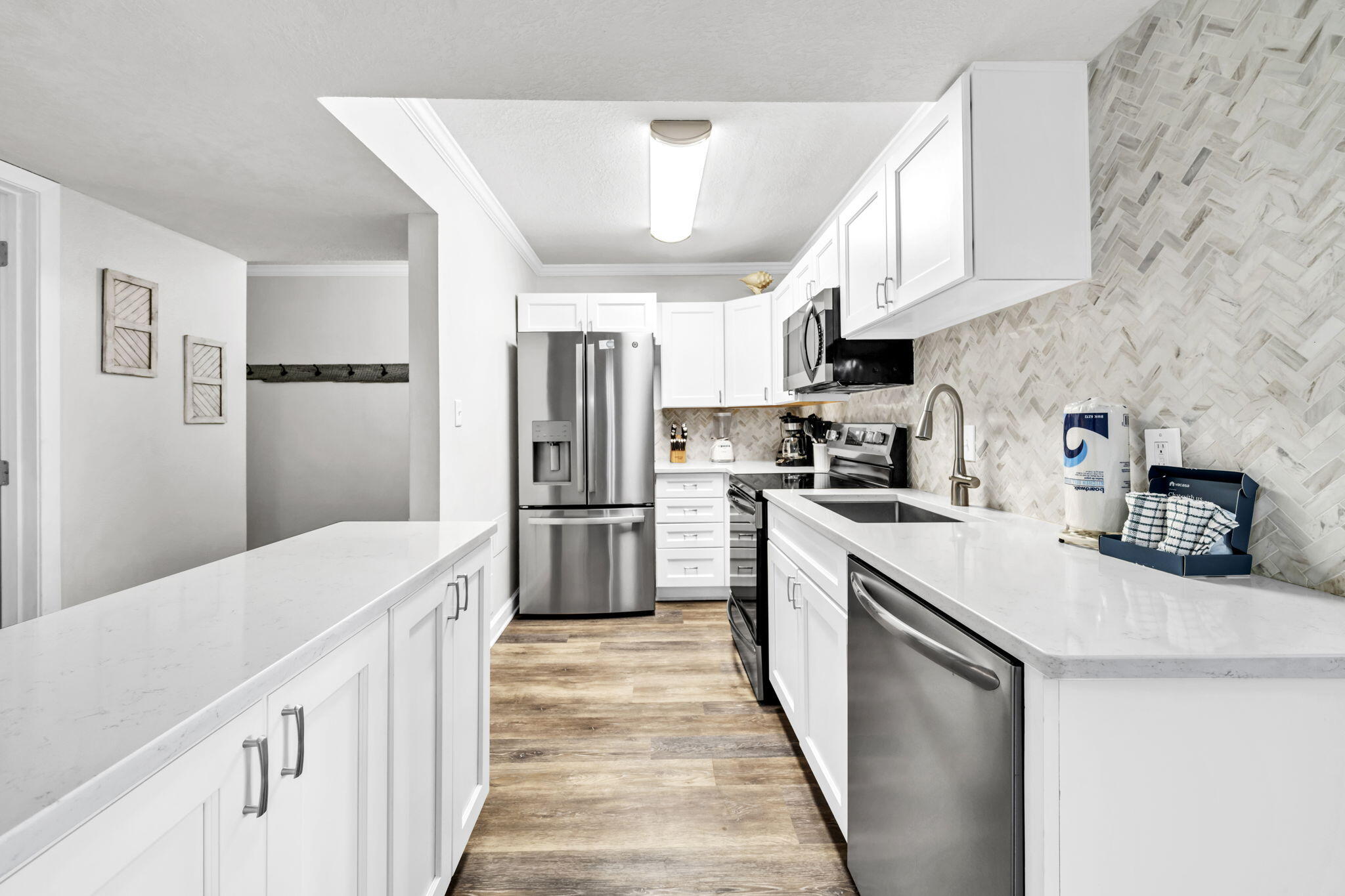 676 Santa Rosa Boulevard, Unit 1F Fort Walton Beach, FL 32548 - Photo 9 of 36 a kitchen with cabinets and stainless steel appliances