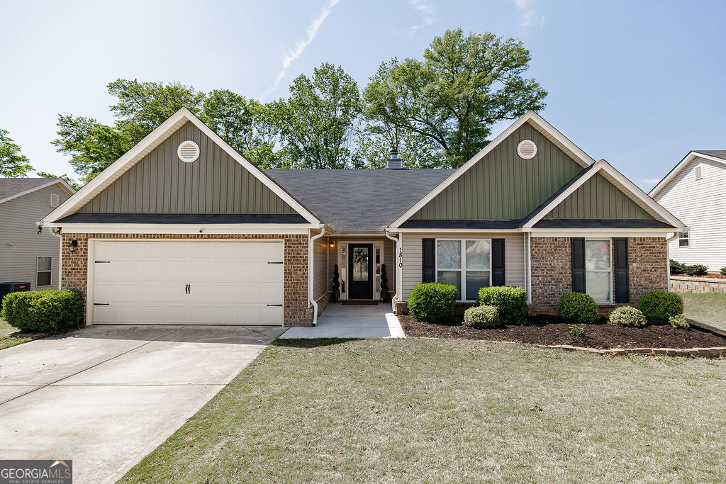1810 Soque Circle Jefferson, GA 30549 - Photo 1 of 1 a front view of a house with garden