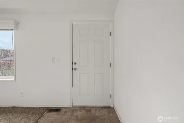 a view of livingroom with furniture ceiling fan and windows