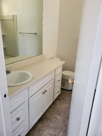 a bathroom with a sink and mirror