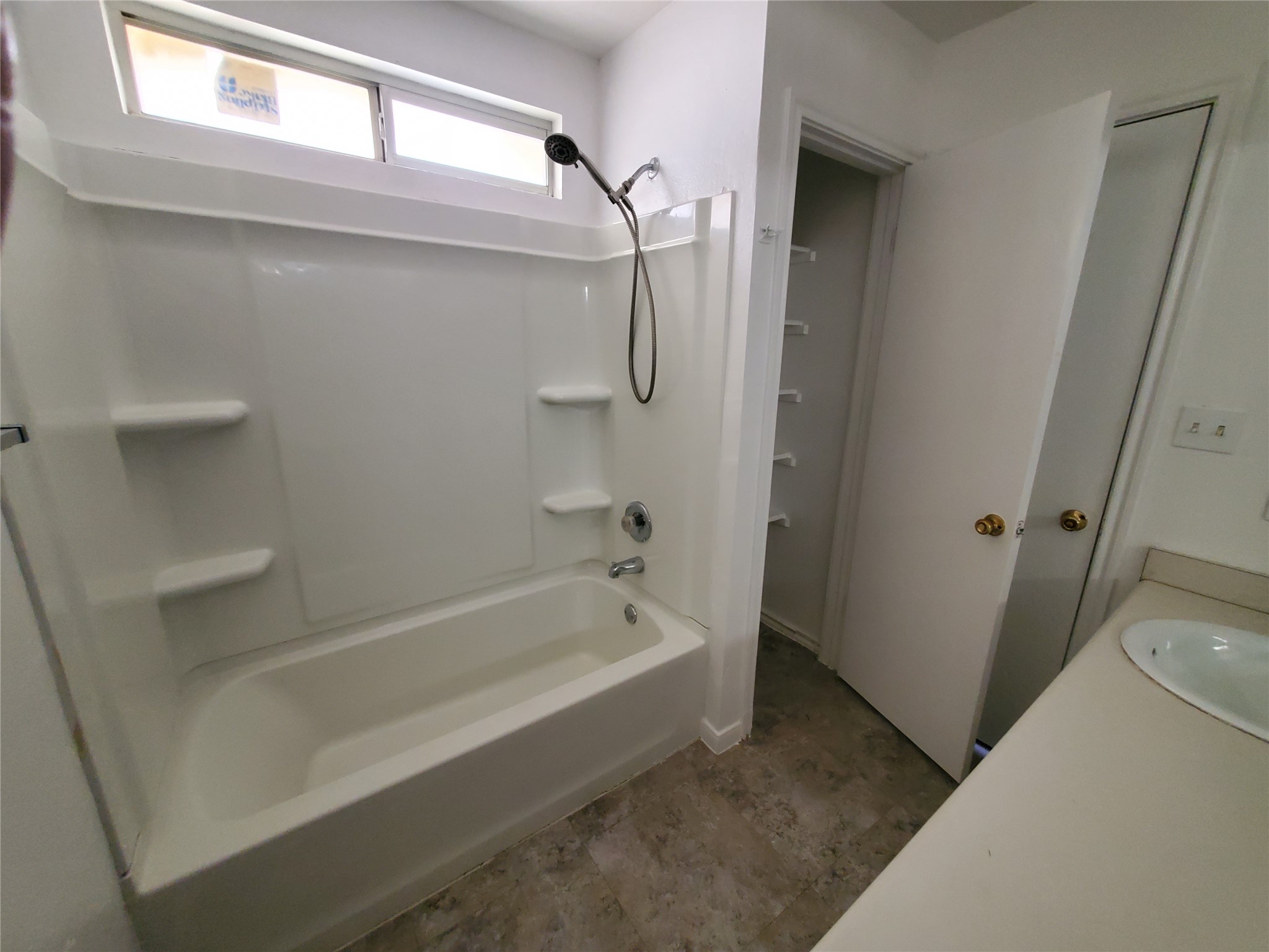 7209 Ritchie Drive Austin, TX 78724 - Photo 14 of 33 a bathroom with a bathtub and a shower