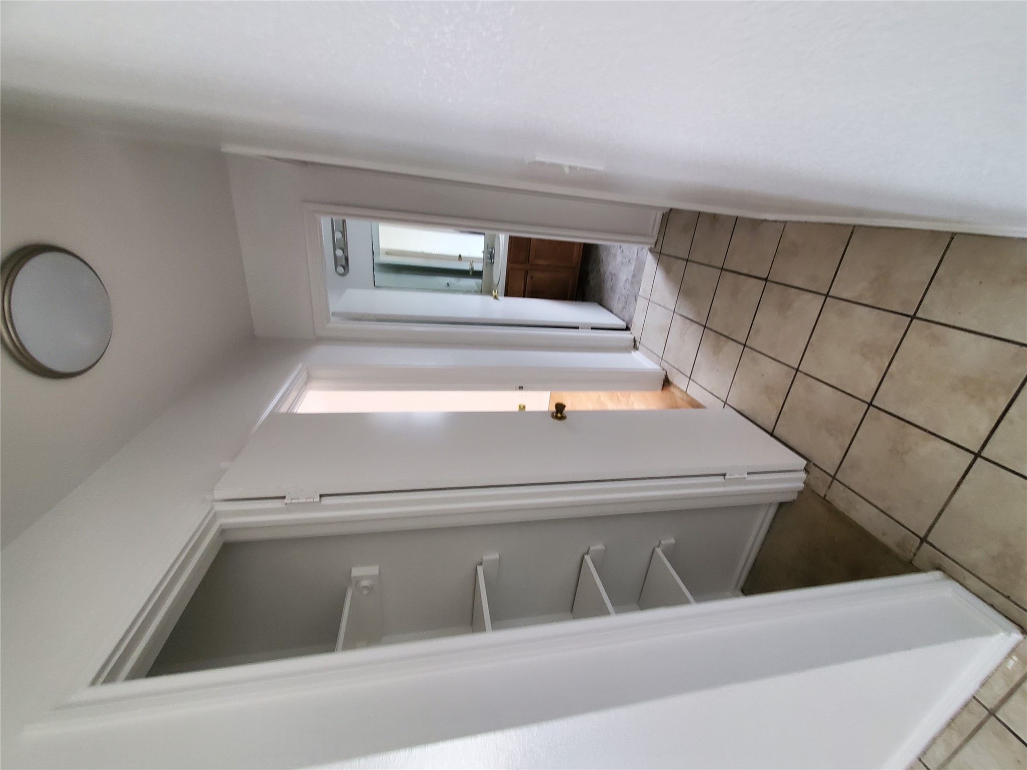 7209 Ritchie Drive Austin, TX 78724 - Photo 18 of 33 a view of empty room with wooden floor and cabinet