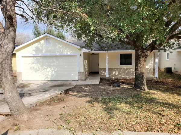 a backyard of a house with yard and garage