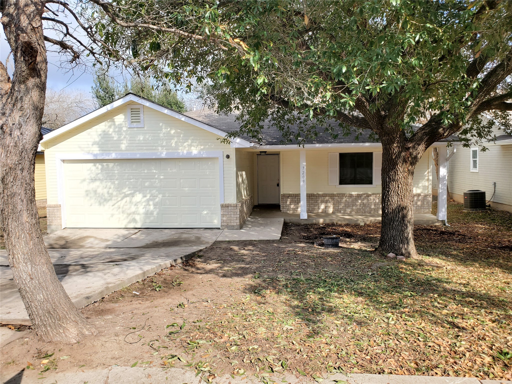 7209 Ritchie Drive Austin, TX 78724 - Photo 2 of 33 a backyard of a house with yard and garage