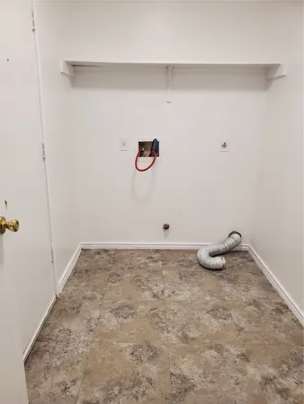 a bathroom with a granite countertop and white vanity