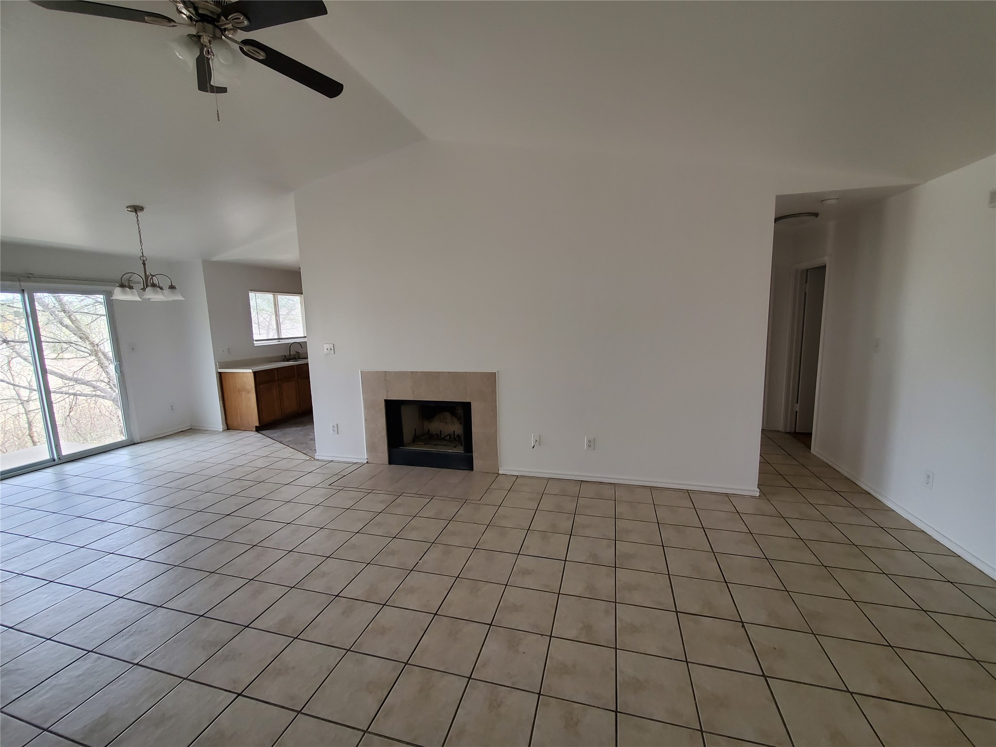 7209 Ritchie Drive Austin, TX 78724 - Photo 4 of 33 a view of an empty room with a fireplace and a window