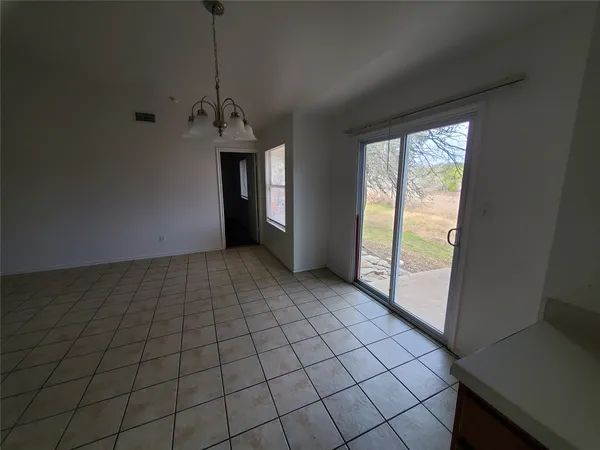 a view of an empty room and window