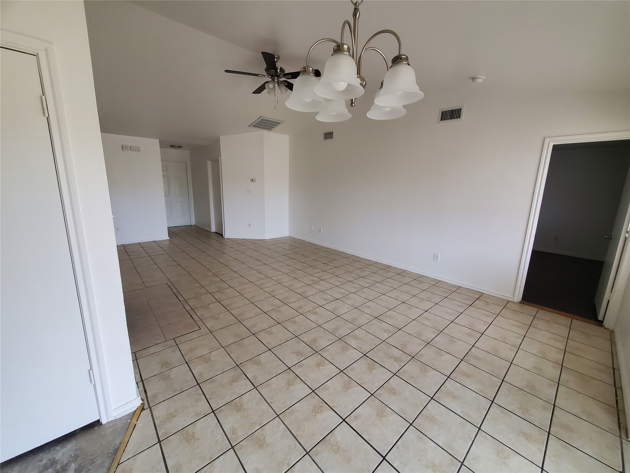 7209 Ritchie Drive Austin, TX 78724 - Photo 7 of 33 a view of a livingroom with a chandelier fan and wooden floor