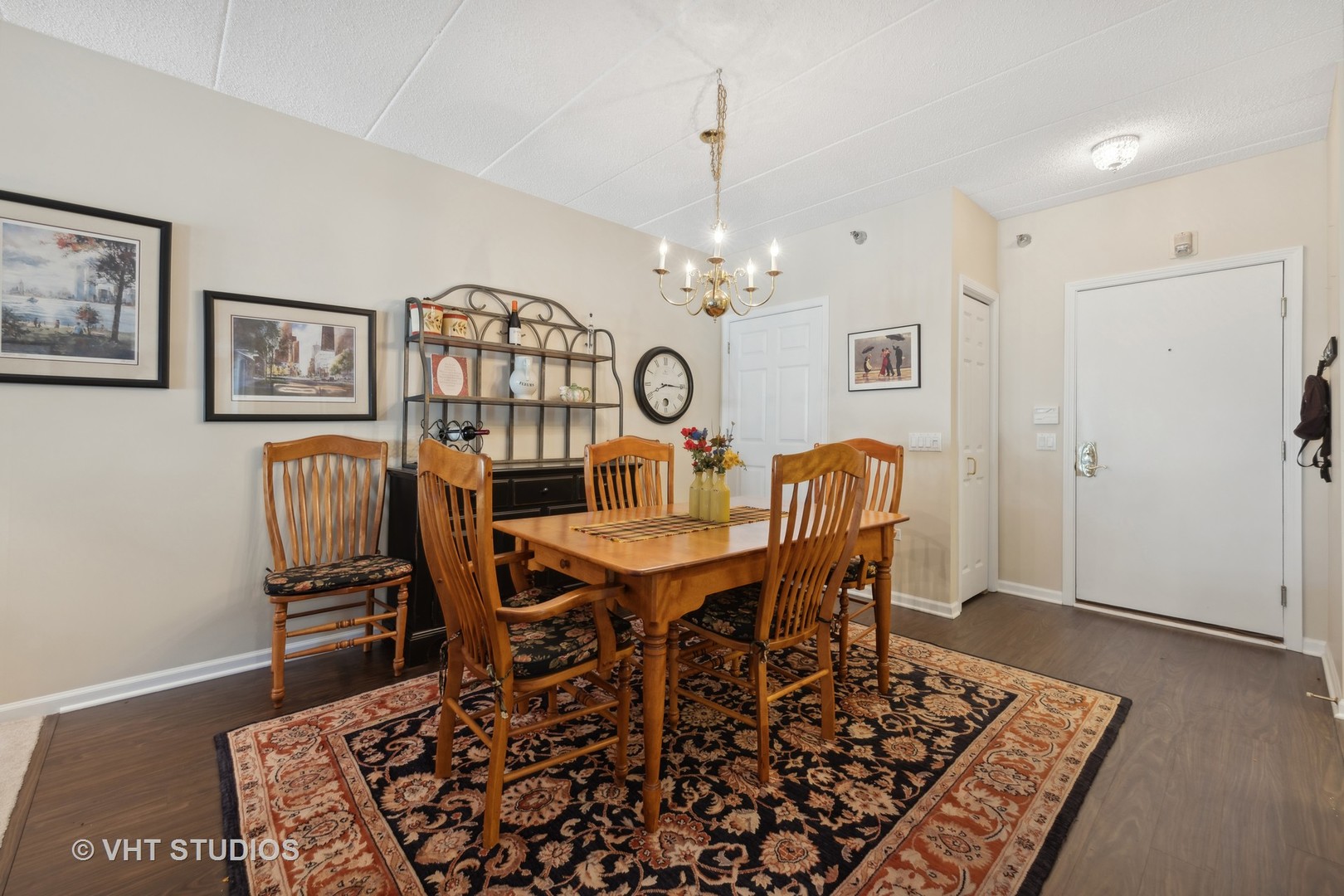 111 North Wheaton Avenue, Unit 306 Wheaton, IL 60187 - Photo 3 of 16 a view of a dining room with furniture