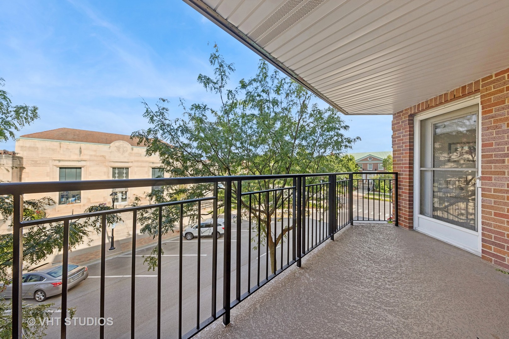 111 North Wheaton Avenue, Unit 306 Wheaton, IL 60187 - Photo 6 of 16 a view of a balcony