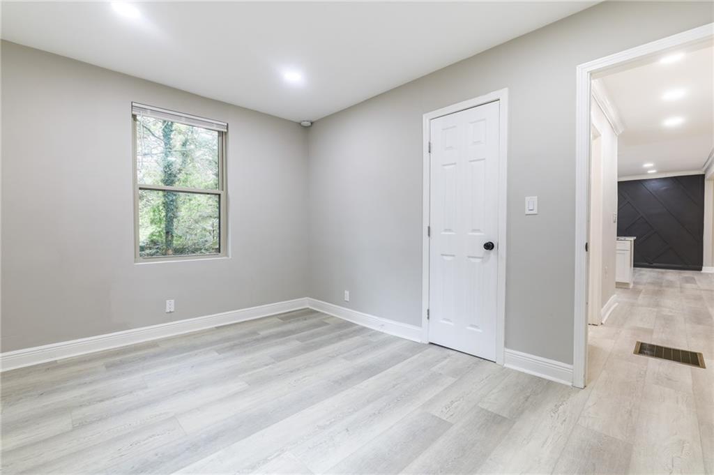 1767 Line Street Decatur, GA 30032 - Photo 15 of 26 wooden floor in an empty room with a window