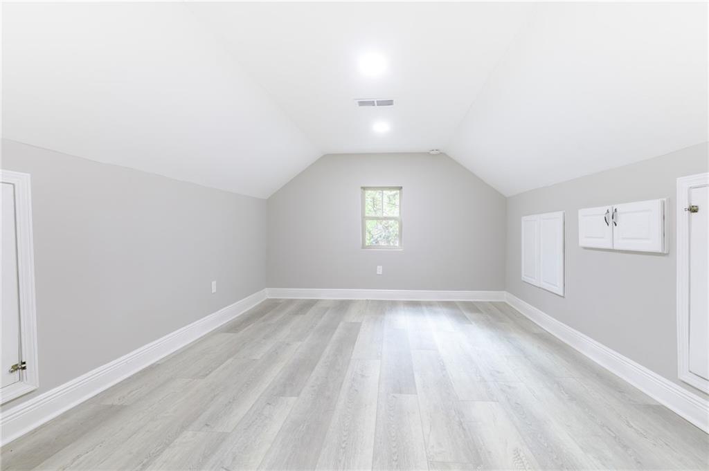 1767 Line Street Decatur, GA 30032 - Photo 16 of 26 wooden floor in an empty room with a window