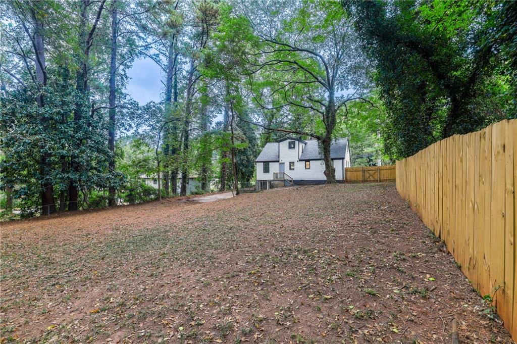 1767 Line Street Decatur, GA 30032 - Photo 24 of 26 a view of large tree with wooden fence