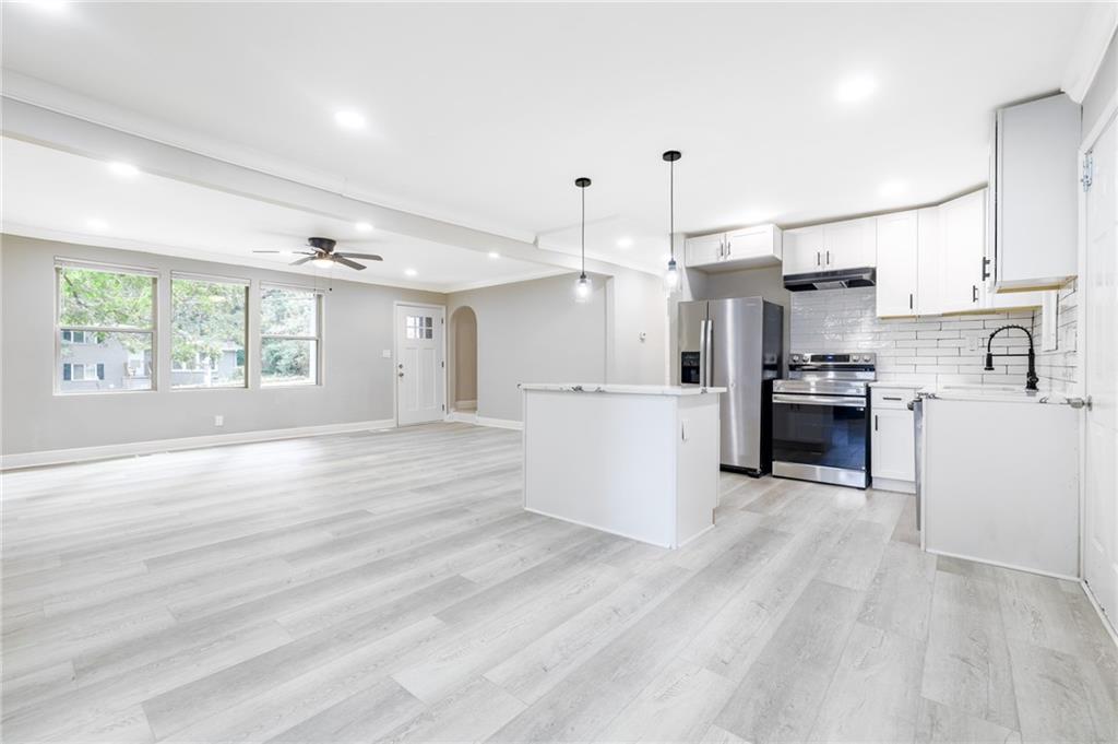 1767 Line Street Decatur, GA 30032 - Photo 5 of 26 a view of a kitchen with wooden floor and electronic appliances