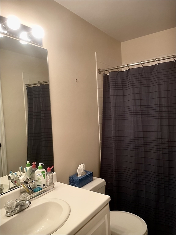 208 Gazebo Circle, Unit 208 Reading, MA 01867 - Photo 7 of 10 a bathroom with a sink and a mirror