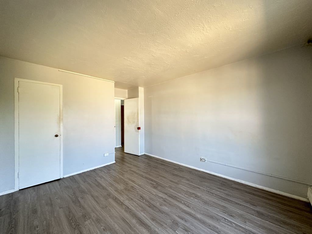 7333 North Ridge Boulevard, Unit 510 Chicago, IL 60645 - Photo 17 of 21 a view of an empty room with wooden floor