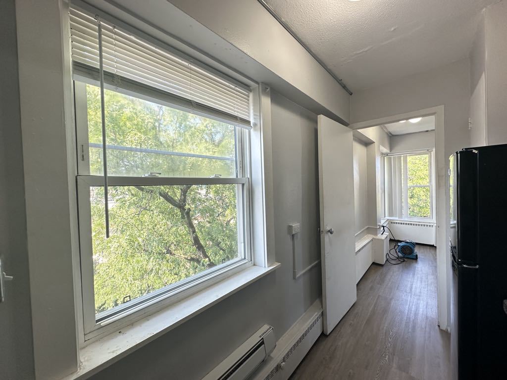 7333 North Ridge Boulevard, Unit 510 Chicago, IL 60645 - Photo 5 of 21 a view of a kitchen with wooden floor and a window