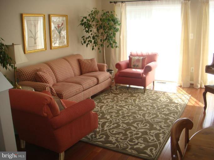 11467 Heritage Commons Way Reston, VA 20194 - Photo 9 of 19 a living room with furniture and a large window