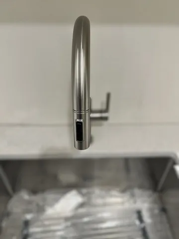 a close view of a sink in the kitchen