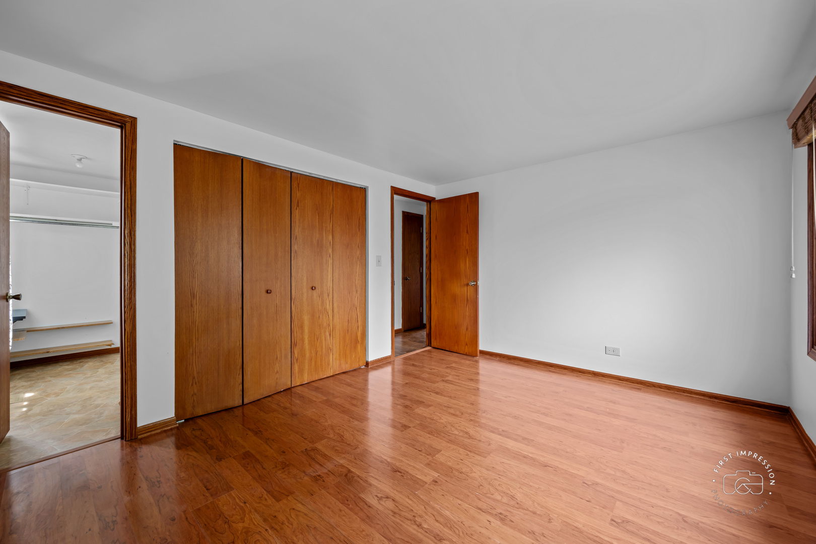 304 Dean Circle Bolingbrook, IL 60440 - Photo 11 of 23 a view of an empty room with wooden floor and a window
