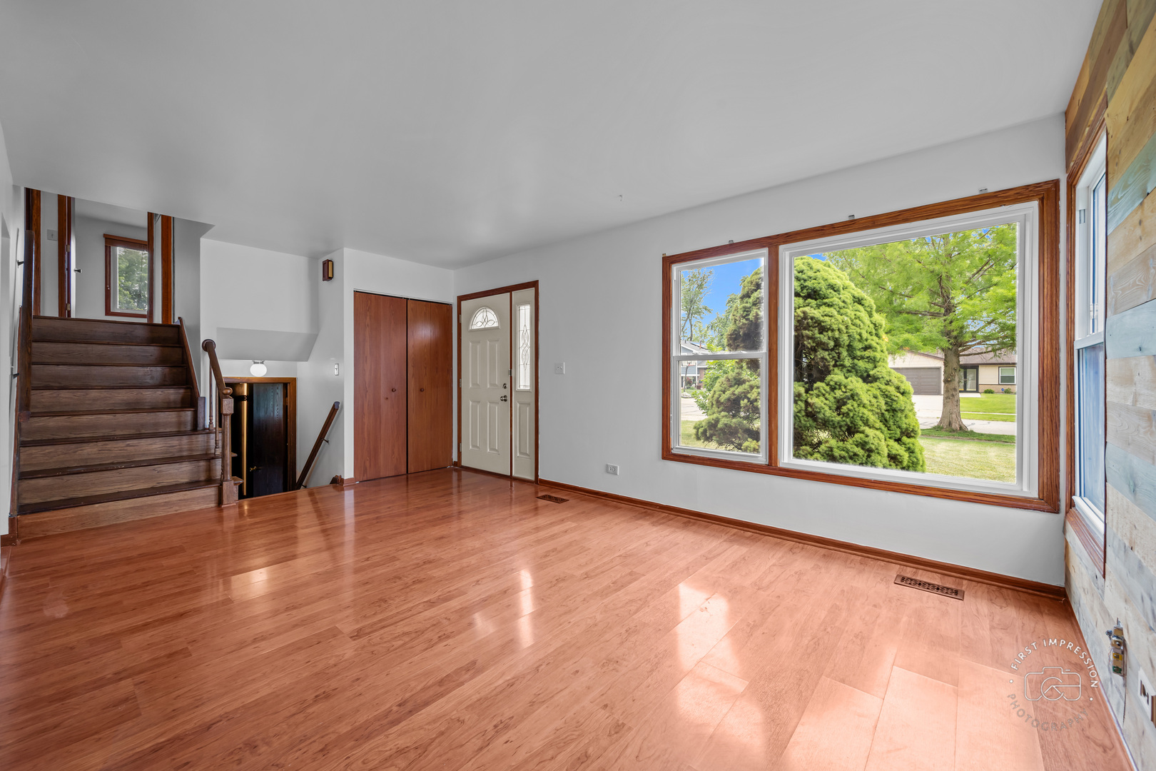 304 Dean Circle Bolingbrook, IL 60440 - Photo 4 of 23 a view of an empty room with wooden floor and a window