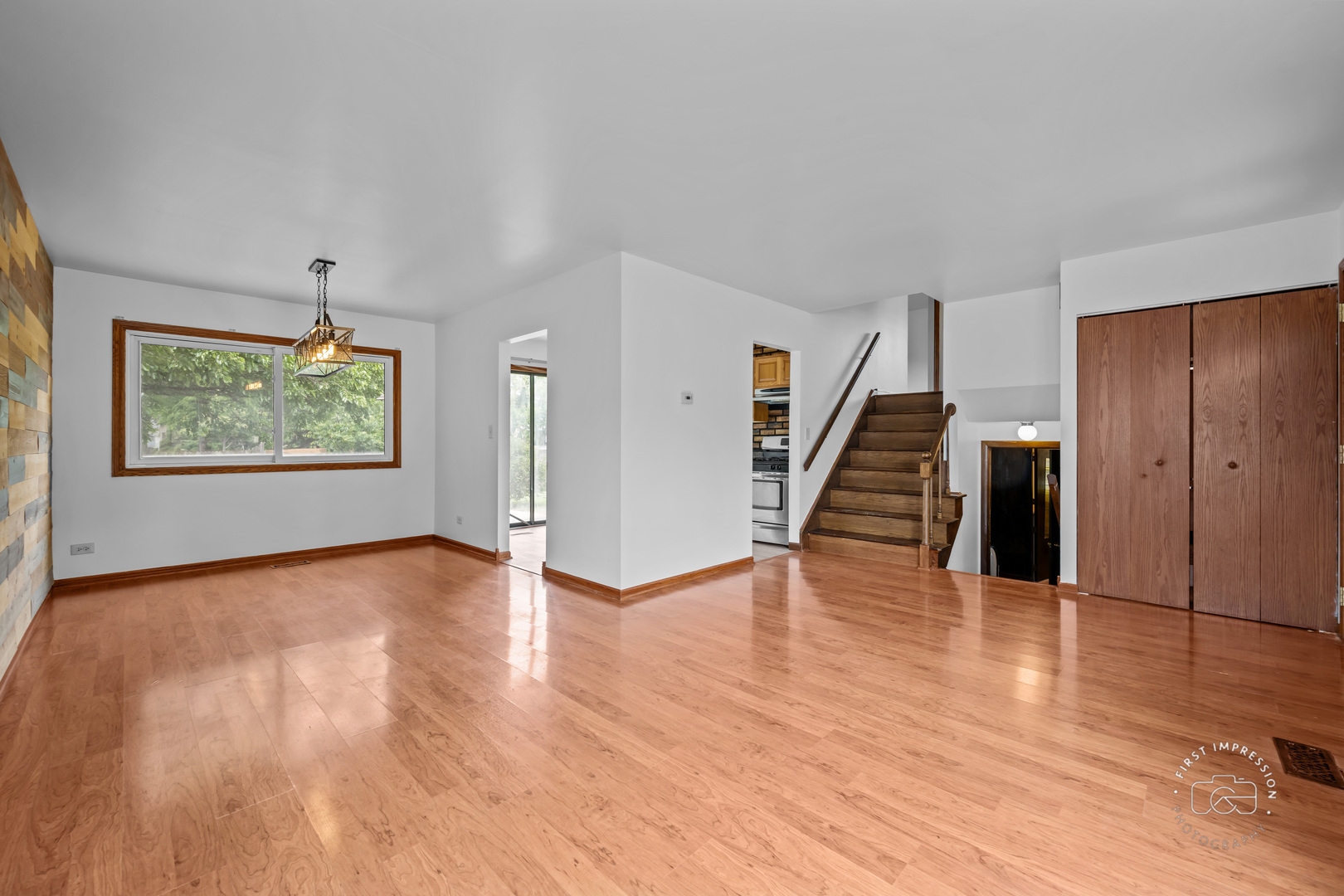 304 Dean Circle Bolingbrook, IL 60440 - Photo 5 of 23 a view of an empty room with wooden floor and stairs