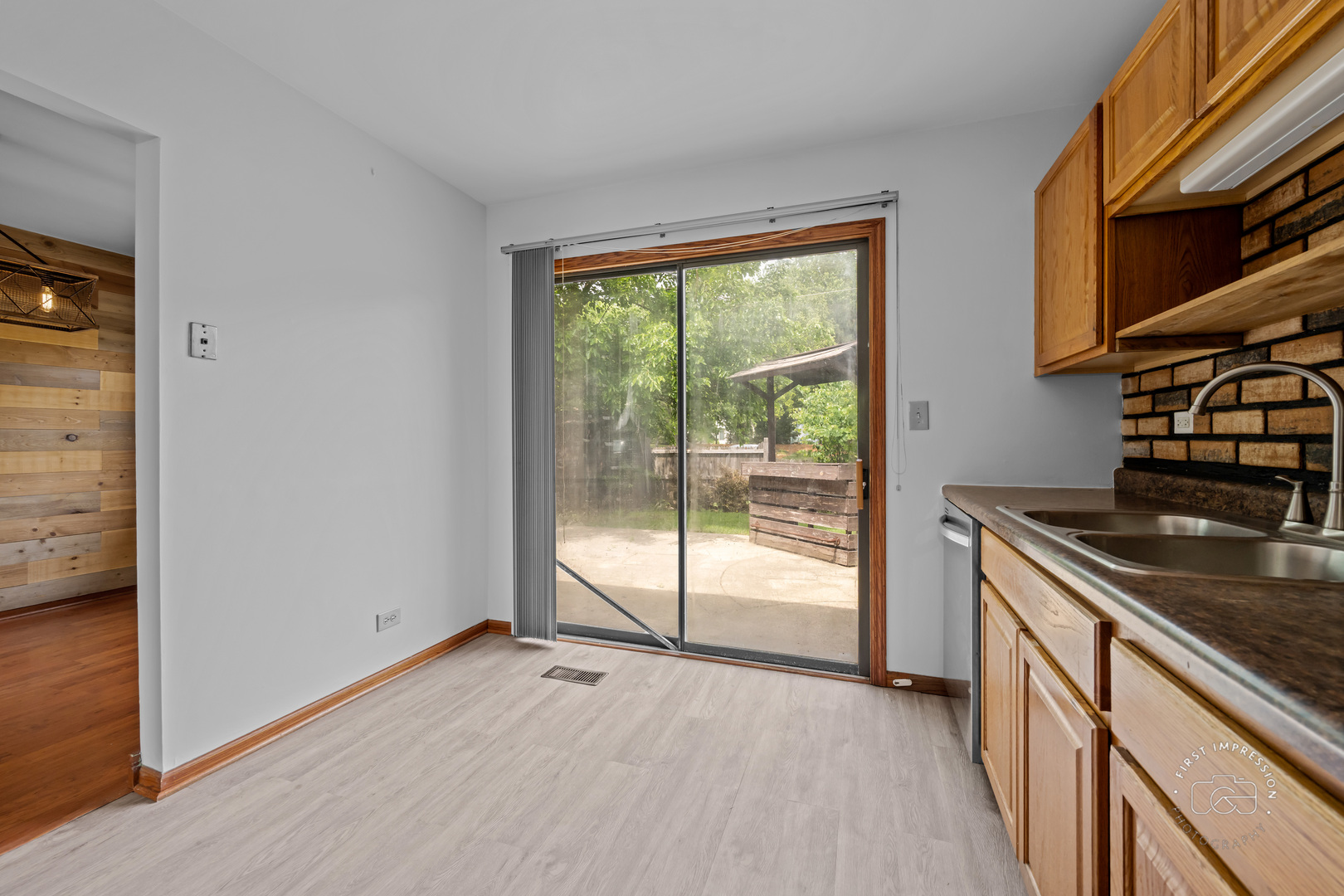 304 Dean Circle Bolingbrook, IL 60440 - Photo 9 of 23 a view of a kitchen with wooden floor and a sink
