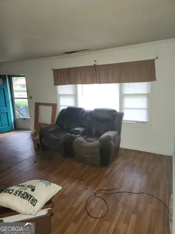 a living room with furniture and a rug