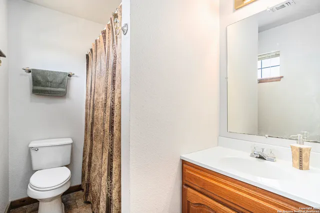 a bathroom with a sink and a toilet