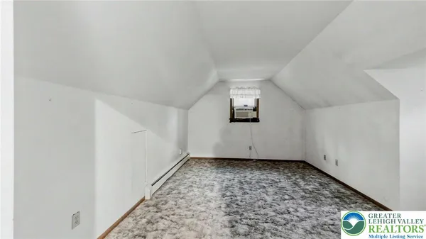 an empty room with a bench