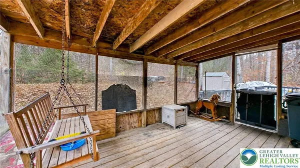 a view of living room with furniture and wooden floor