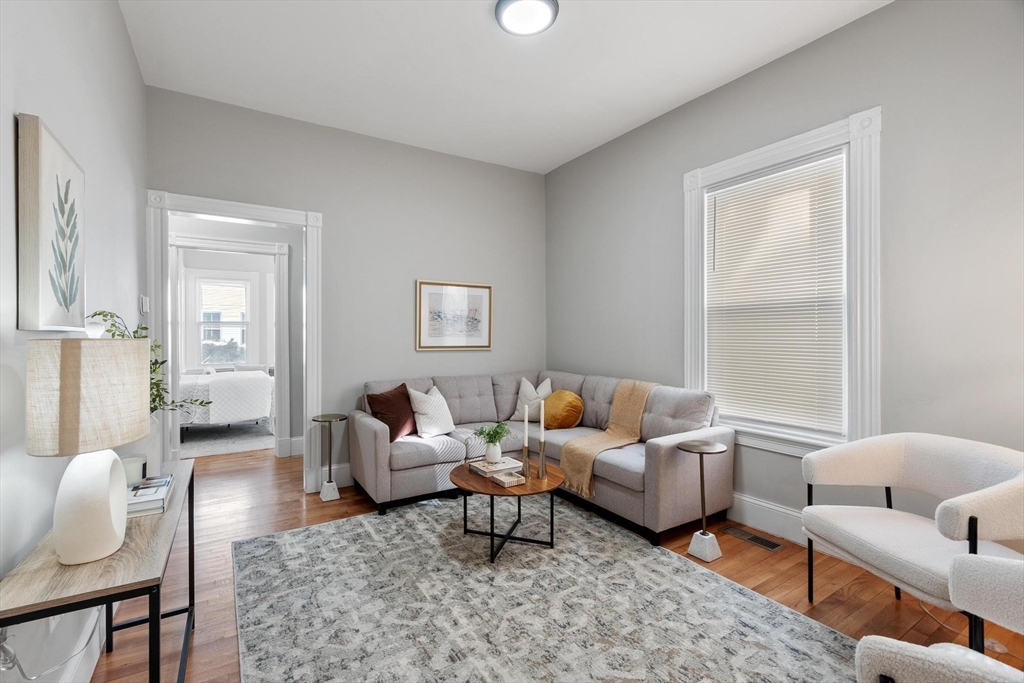 17 Buckingham Street, Unit 2 Somerville, MA 02143 - Photo 4 of 14 a living room with furniture and a window
