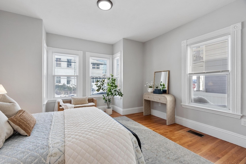 17 Buckingham Street, Unit 2 Somerville, MA 02143 - Photo 7 of 14 a bedroom with a large bed and windows
