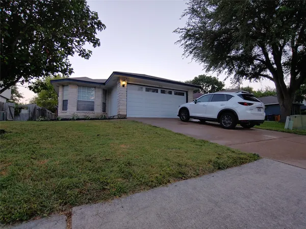 a view of a car in front of a house