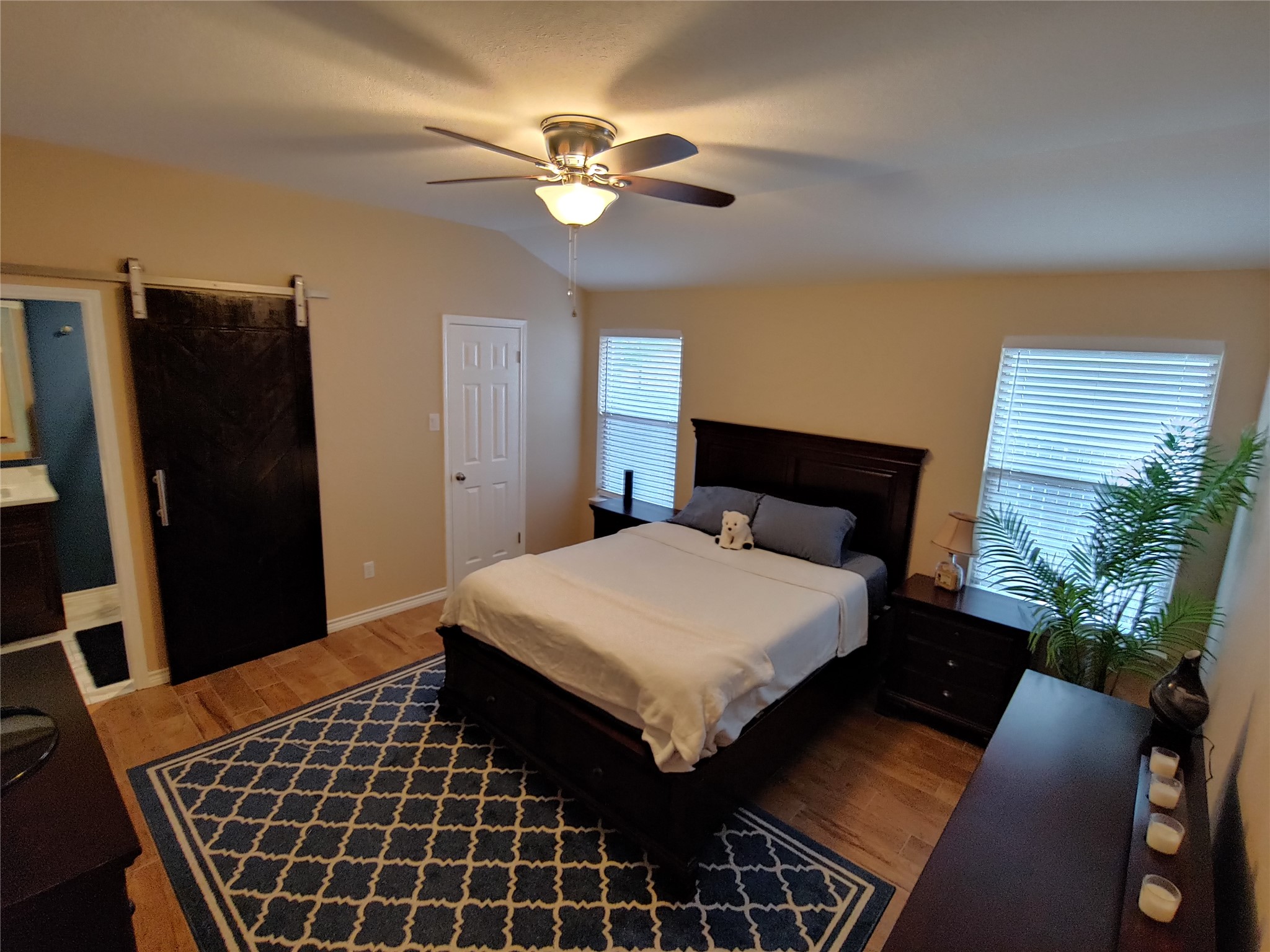 8124 Tockington Way Austin, TX 78748 - Photo 11 of 28 a bedroom with a bed and a walk in closet