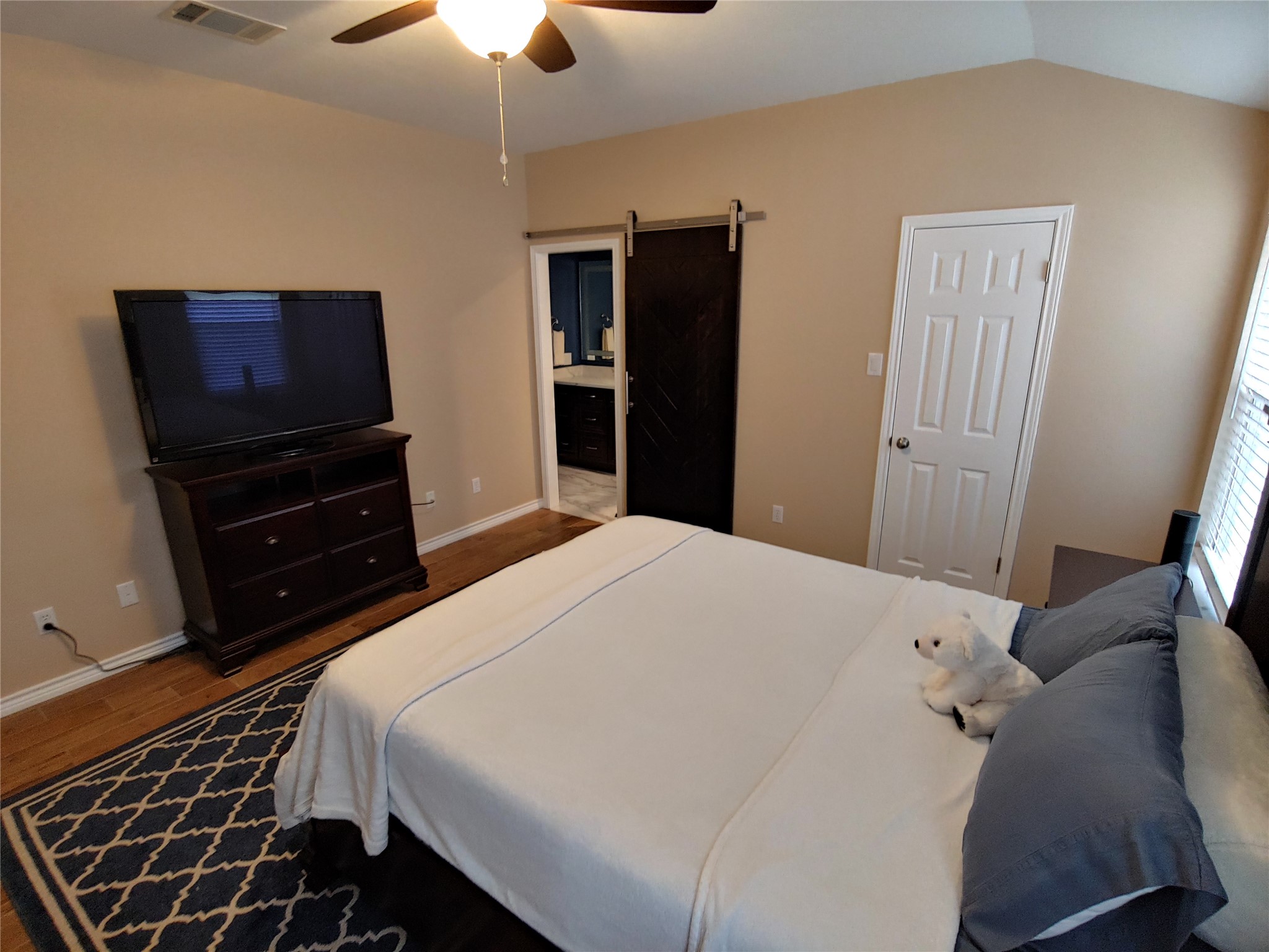 8124 Tockington Way Austin, TX 78748 - Photo 12 of 28 a bedroom with a bed and a television