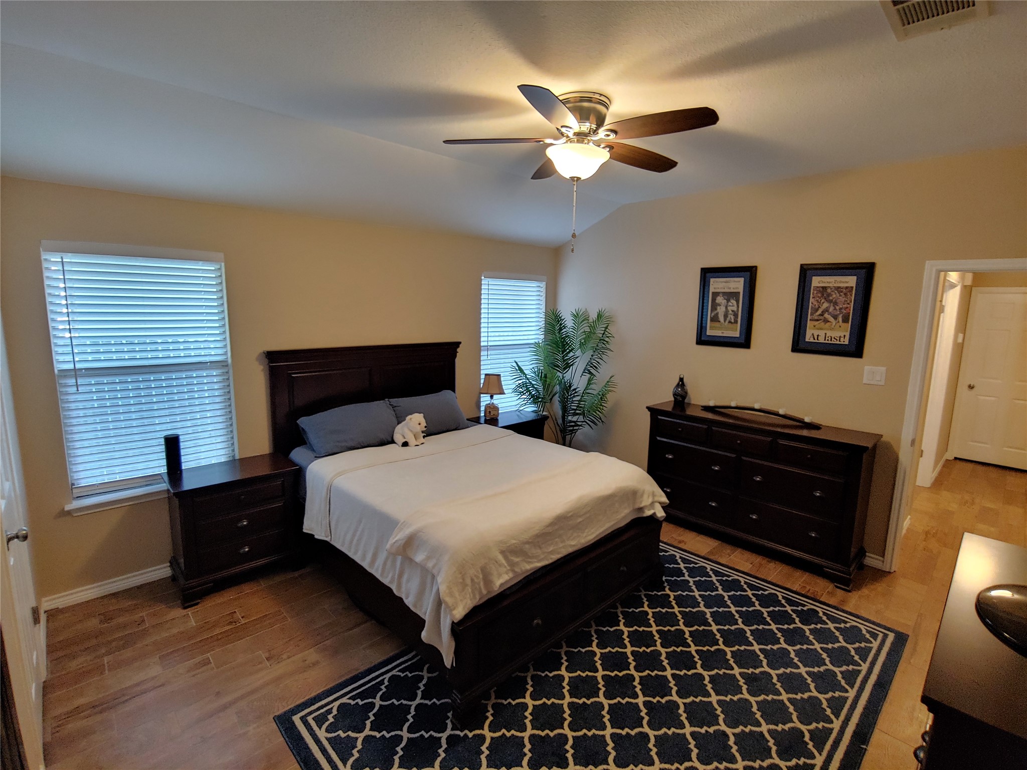 8124 Tockington Way Austin, TX 78748 - Photo 13 of 28 a bedroom with a bed and a chandelier
