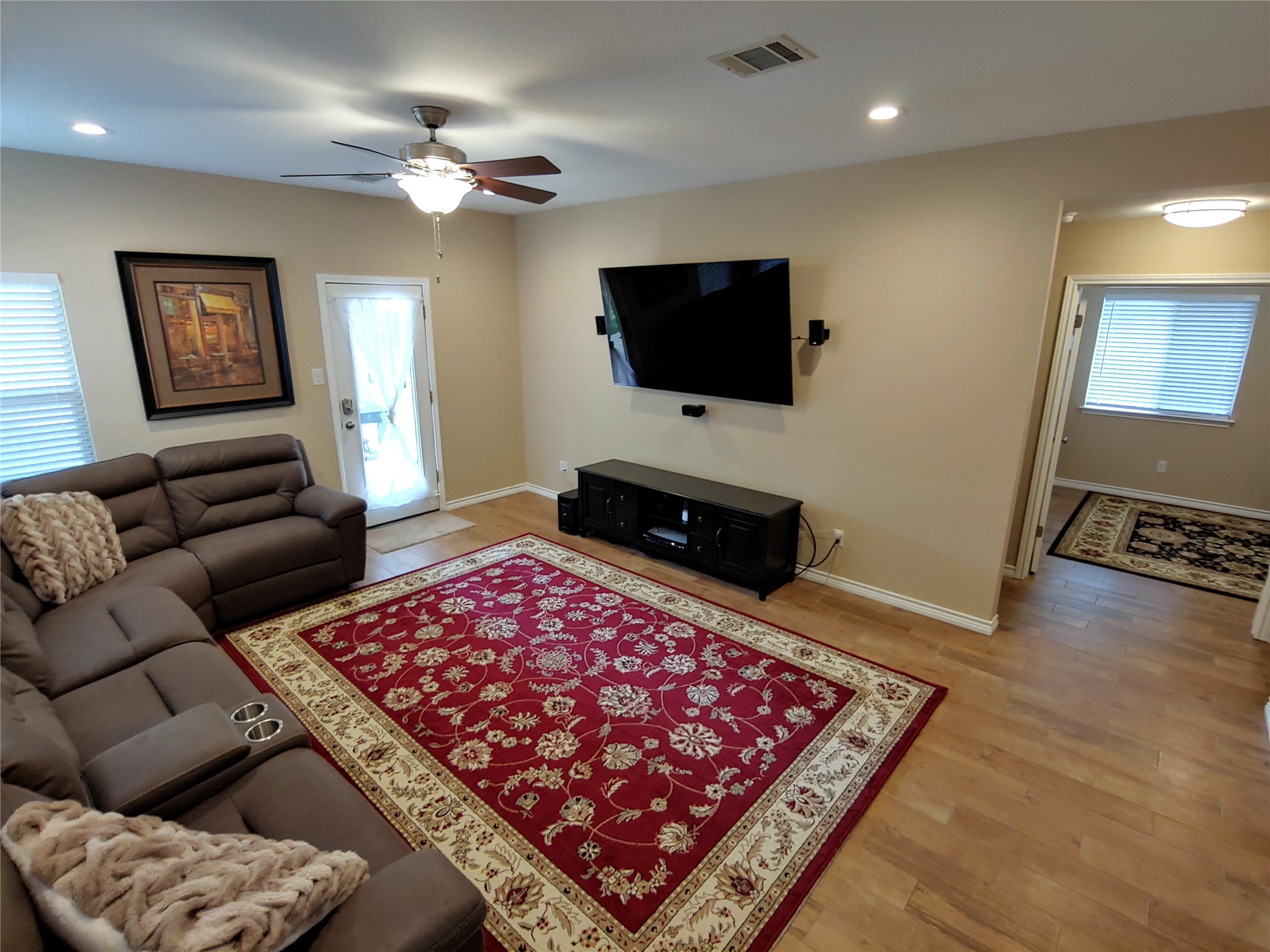 8124 Tockington Way Austin, TX 78748 - Photo 2 of 28 a living room with furniture and a flat screen tv