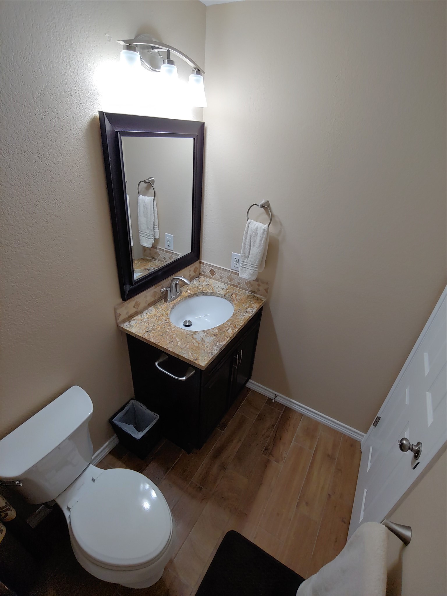 8124 Tockington Way Austin, TX 78748 - Photo 23 of 28 a bathroom with a toilet sink and mirror