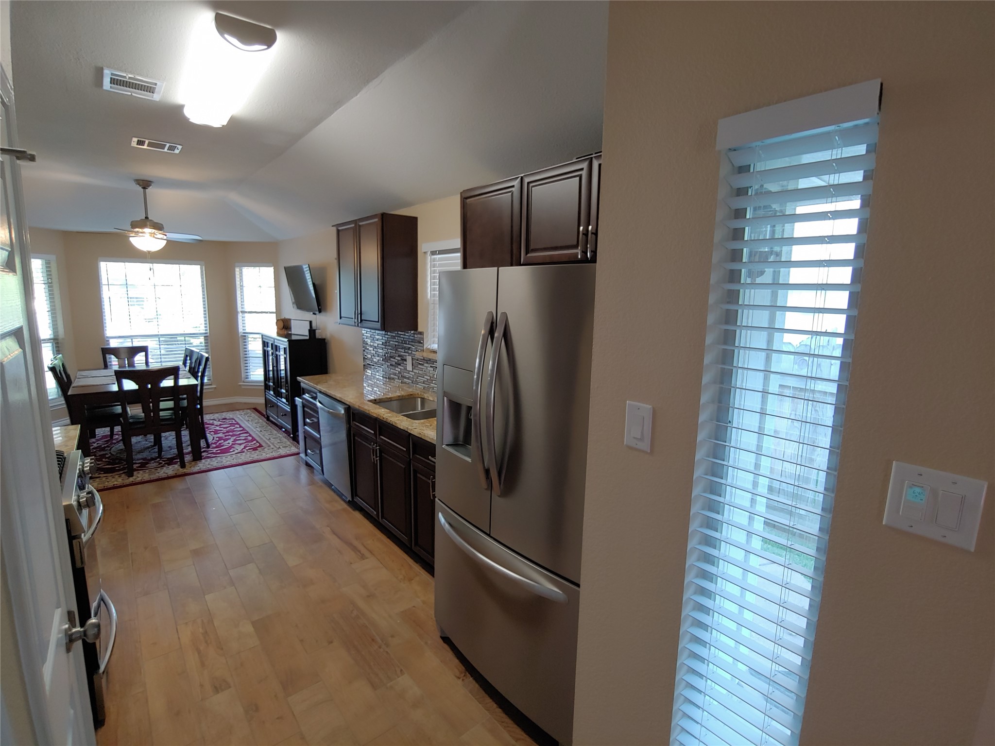 8124 Tockington Way Austin, TX 78748 - Photo 7 of 28 a kitchen with stainless steel appliances granite countertop a refrigerator and a stove