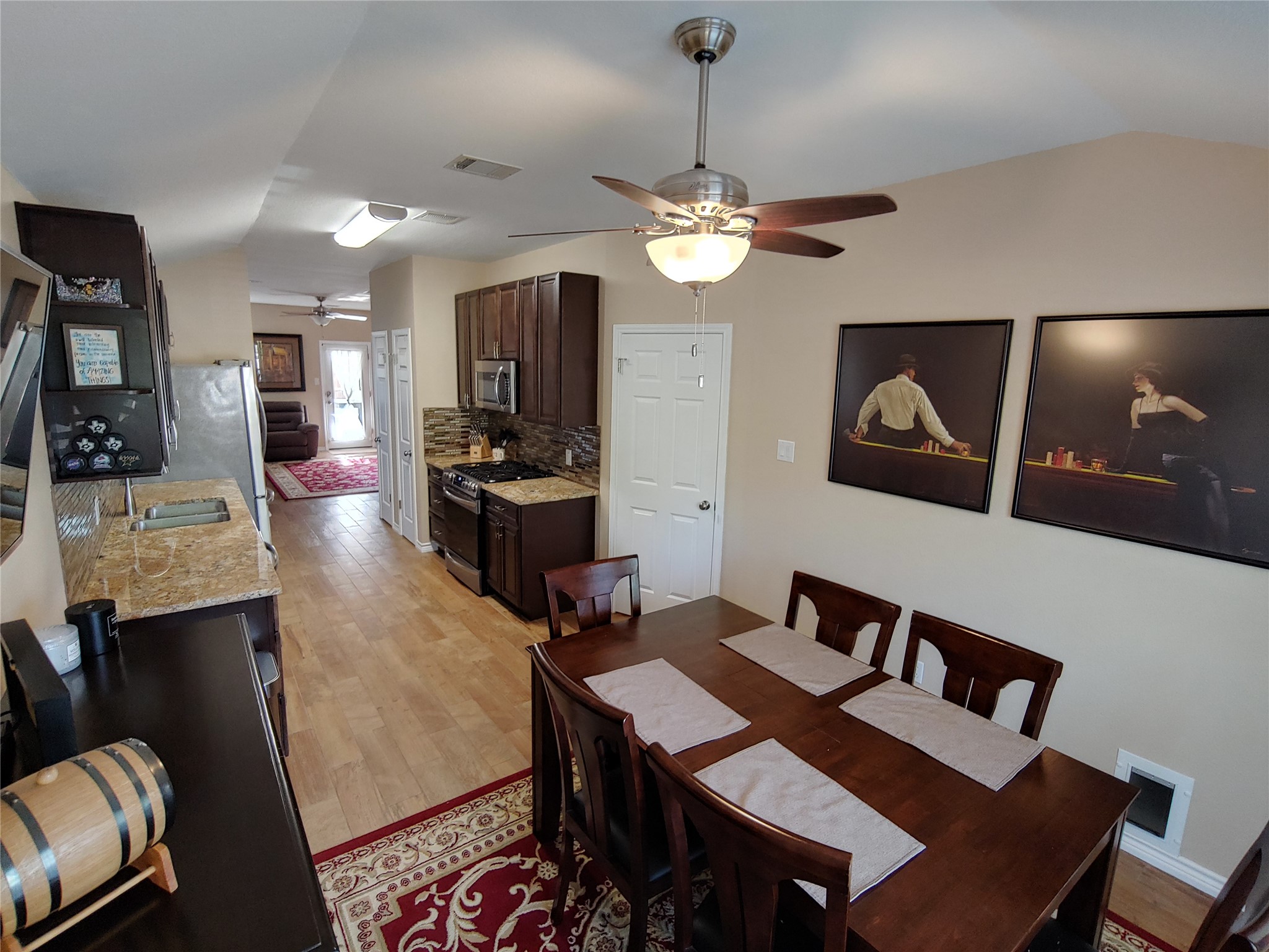 8124 Tockington Way Austin, TX 78748 - Photo 9 of 28 a view of a dining room with furniture and wooden floor