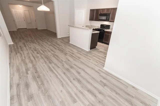 a view of a kitchen from the hallway