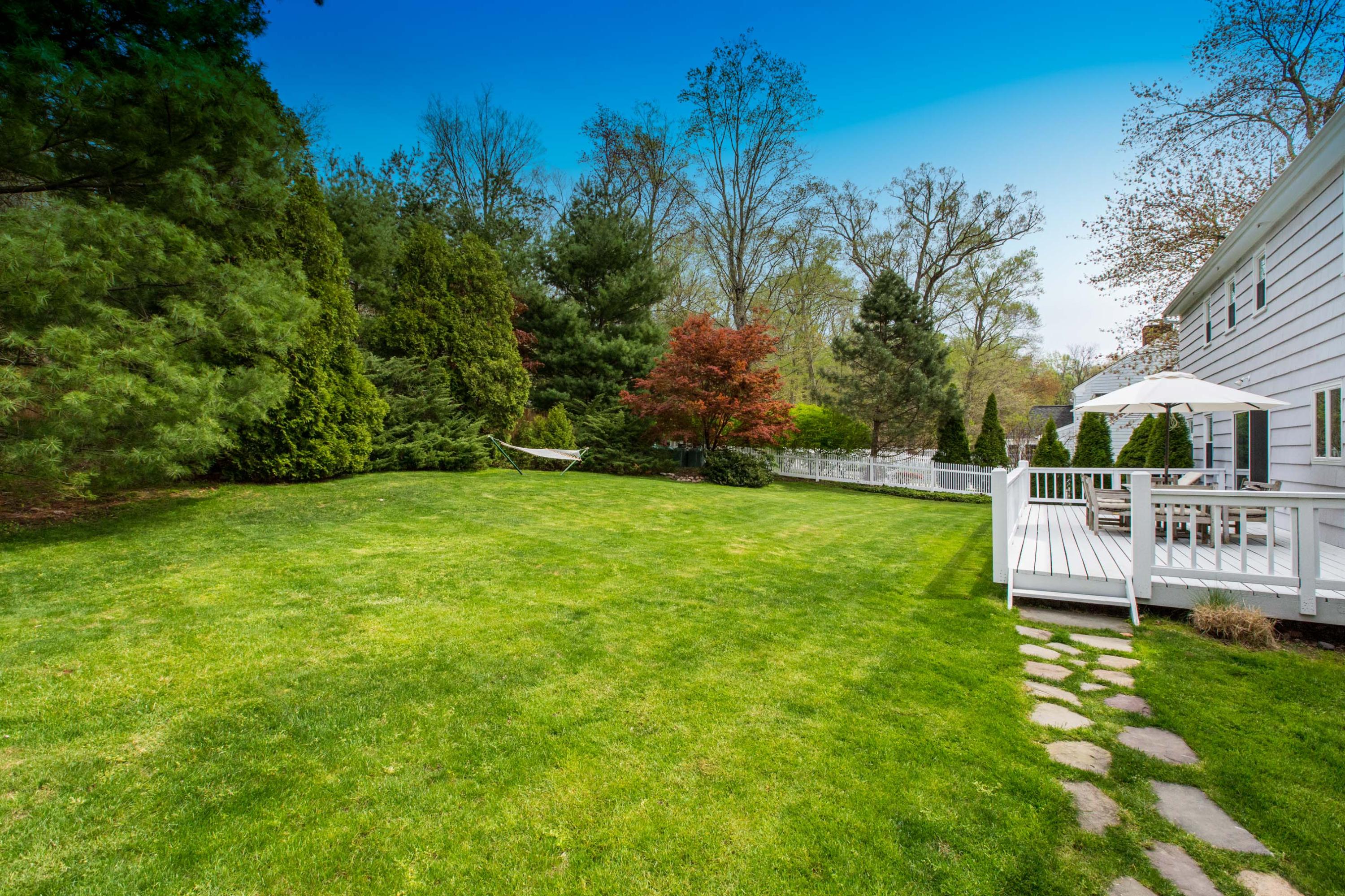 49 Country Club Road Darien, CT 06820 - Photo 28 of 30 a view of yard with swimming pool and green space