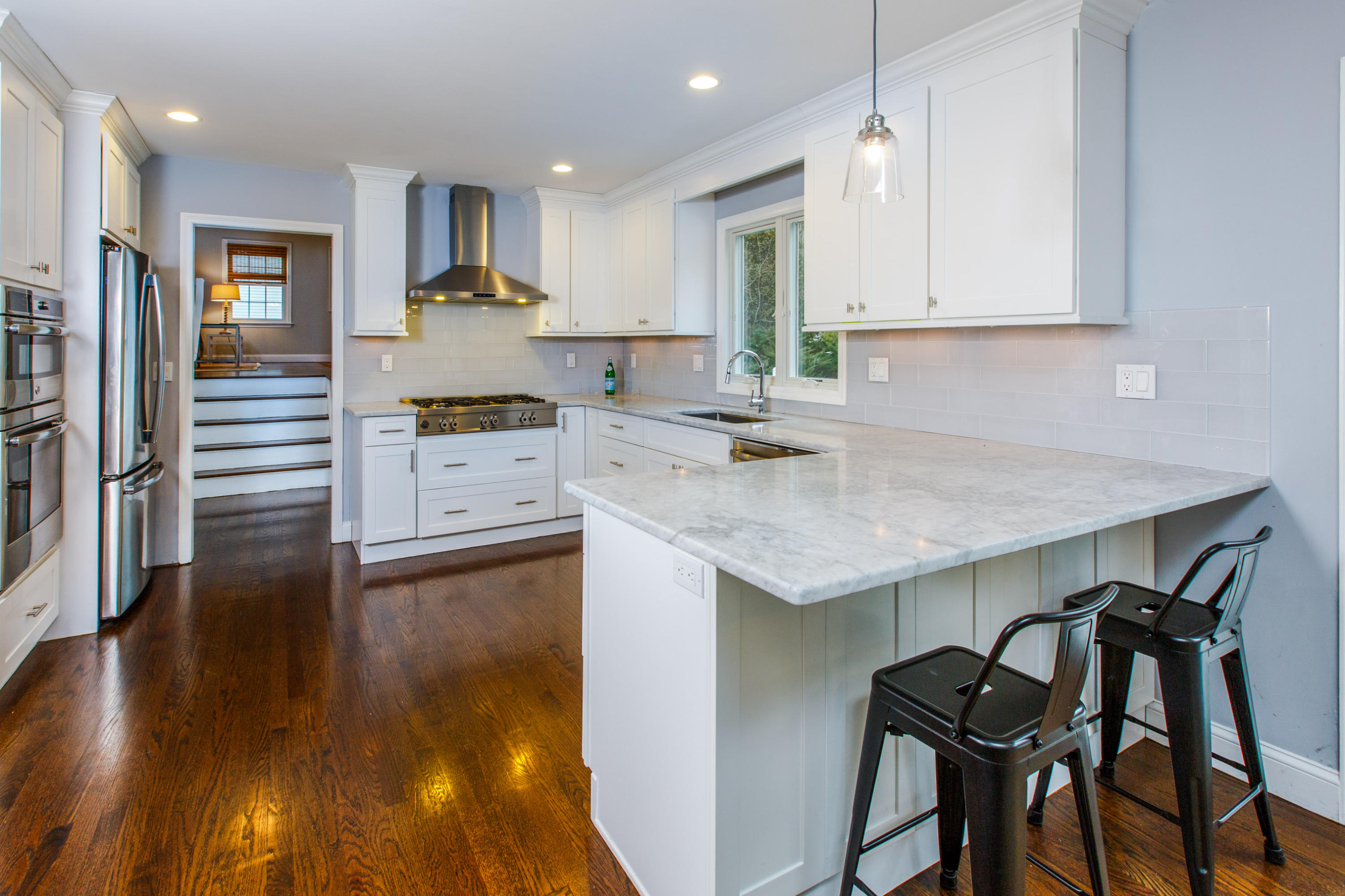 49 Country Club Road Darien, CT 06820 - Photo 7 of 30 a kitchen with a table chairs sink and cabinets