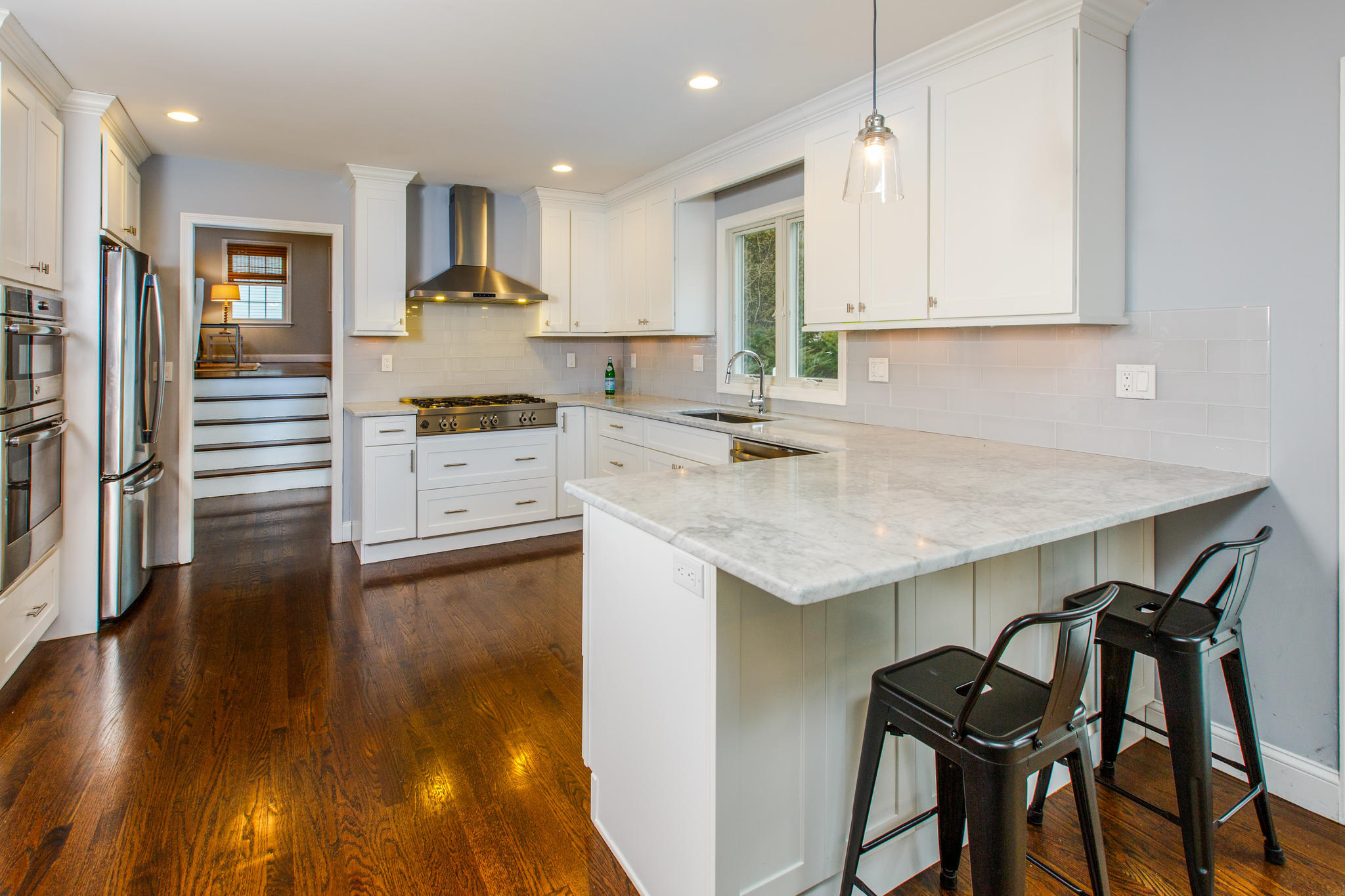 49 Country Club Road Darien, CT 06820 - Photo 9 of 30 a kitchen with a table chairs sink and cabinets