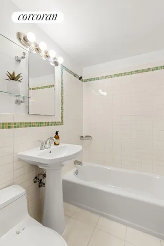 a bathroom with a sink a toilet and a bathtub