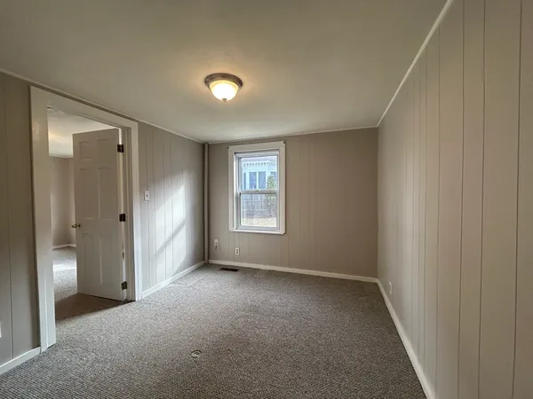 a view of hallway with a large window