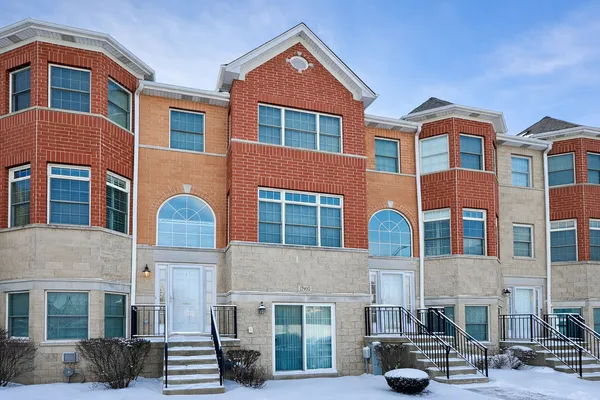 a front view of a building with many windows