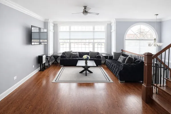 a living room with furniture fireplace and flat screen tv