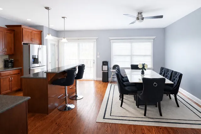 a view of a dining room with furniture window and wooden floor
